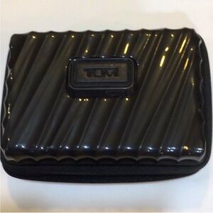 TUMI by Delta Glossy Black mini hard shell Case